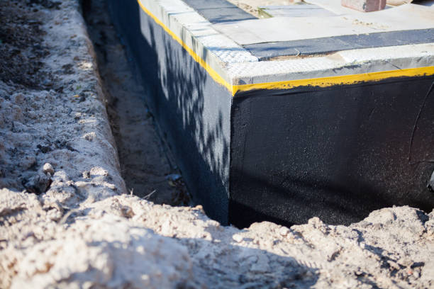 Professional Interior Drainage System technician working in Malone, WI